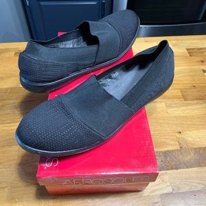 Black flat slip-on sneakers